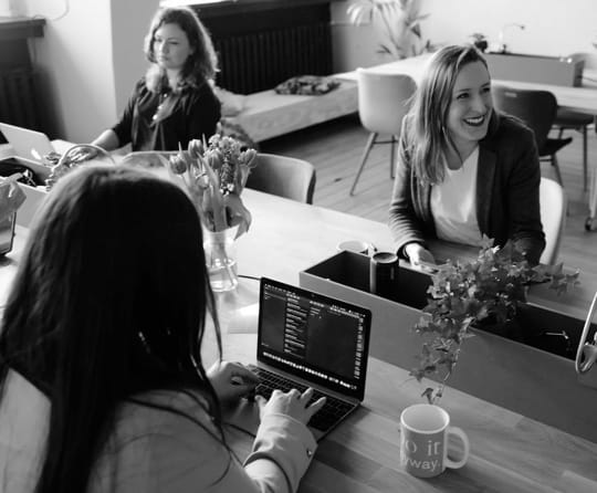 Three women on their work desk